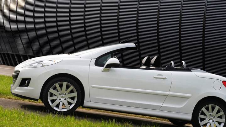 Side Pose Of Peugeot 207 CC Restyled In White
